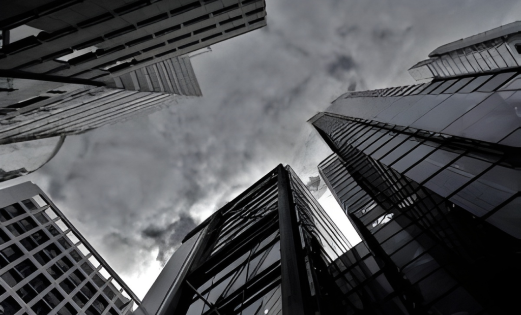 Business tort litigation in Arizona involving fraud and interference claims shown by a commercial building under stormy clouds