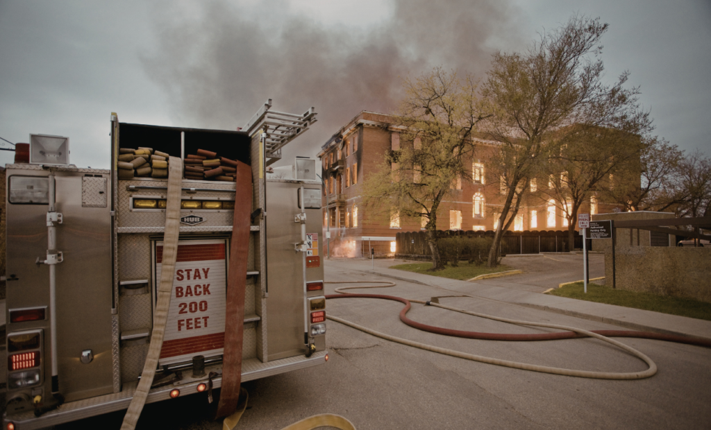 Fire truck responding to burning house representing burn injury and fire accident case handled by a lawyer in Arizona