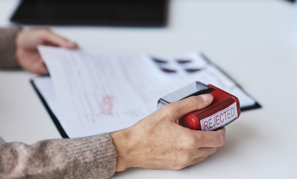 Denied insurance claim paperwork representing insurance bad faith and policyholder dispute in Arizona