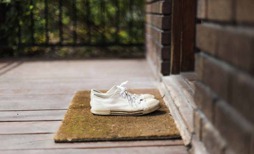 Wrongful death attorney in Arizona representing families with shoes left outside a home symbolizing loss and fatal accident cases